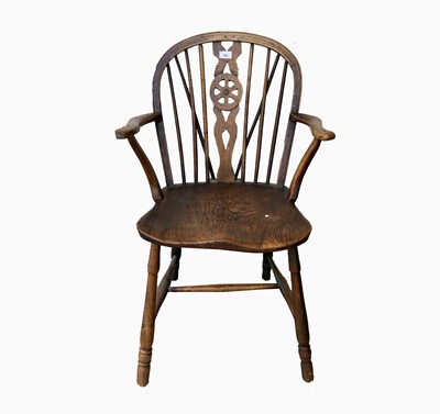 Lot 316 - A Victorian elm wheelback Windsor chair,...