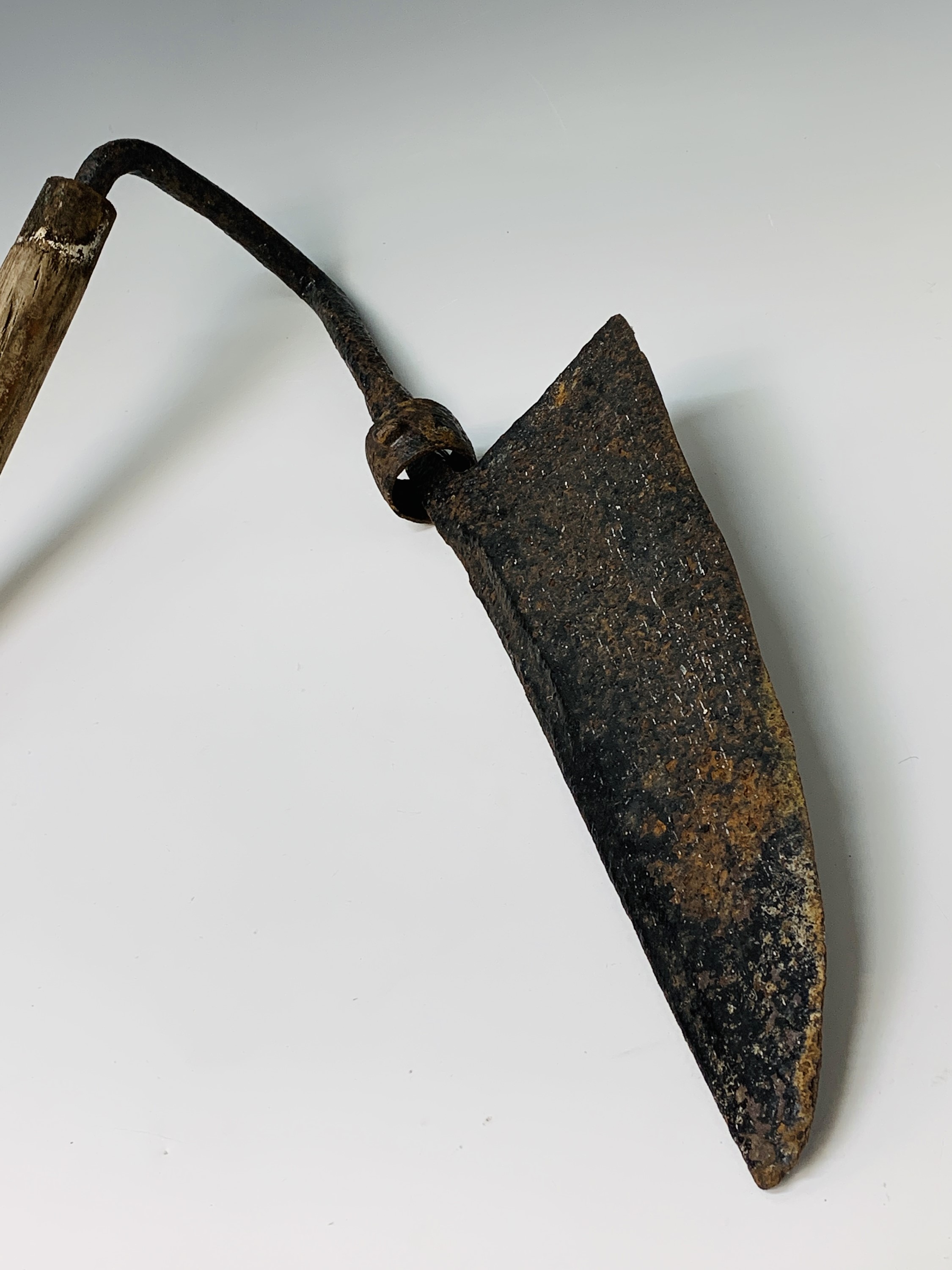 Lot 319 - A hay knife, circa 1900, with black painted