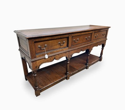 Lot 328 - A George III style oak dresser base, the...