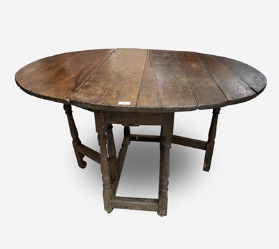 Lot 330 - An oak gateleg dining table, early 18th...