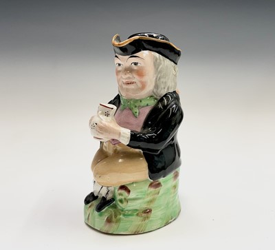 Lot 343 - A Staffordshire pottery Toby jug, circa 1820,...