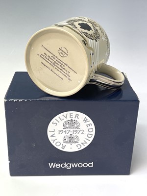 Lot 828 - Three Wedgwood commemorative mugs designed...