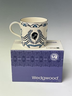 Lot 828 - Three Wedgwood commemorative mugs designed...