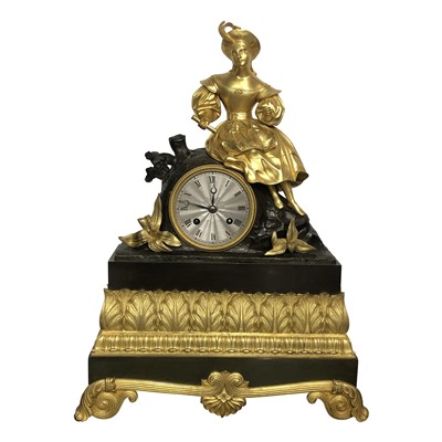 Lot 526 - A French bronze and gilt metal mantel clock.