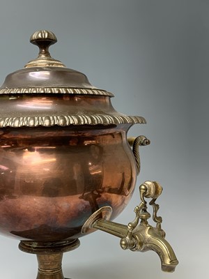 Lot 358 - A Regency copper tea urn, with brass tap,...