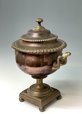 Lot 358 - A Regency copper tea urn, with brass tap,...