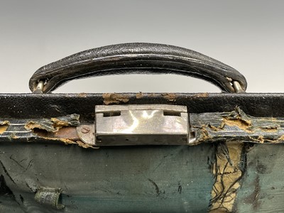 Lot 57 - An Edwardian black leather toilet case with...