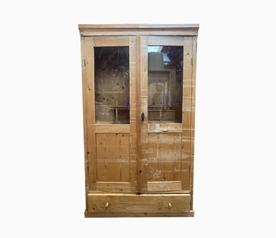 Lot 377 - A Danish pine cabinet, early 20th century,...