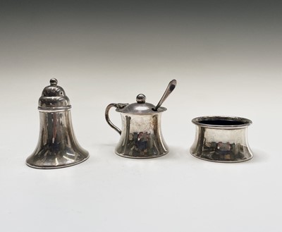 Lot 118 - A three-piece silver plated cruet set, each...