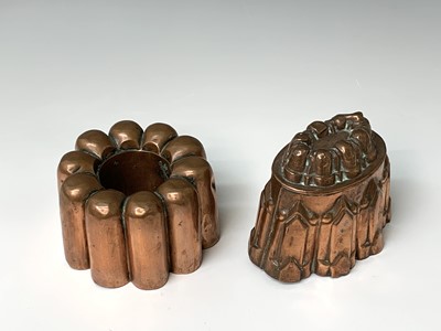 Lot 361 - Two Victorian copper jelly moulds, height 13,...