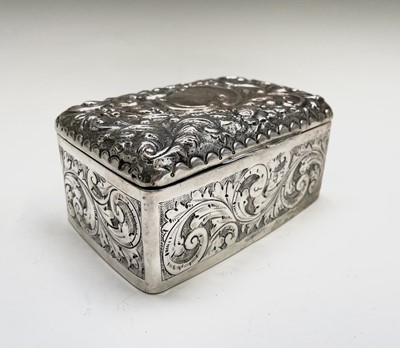 Lot 450 - An Edwardian silver ornate cigarette box,...