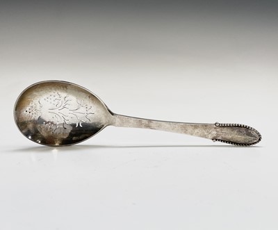 Lot 394 - A Georg Jensen Ltd silver straining spoon in...