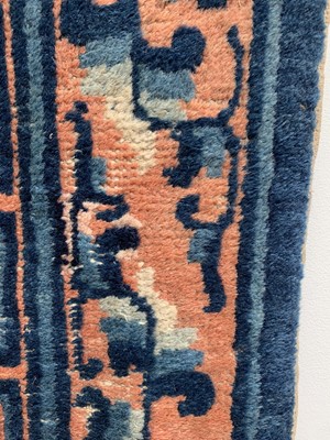 Lot 1252 - A Chinese rug, mid 19th century, the peach...