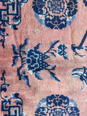 Lot 1252 - A Chinese rug, mid 19th century, the peach...