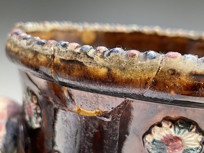 Lot 815 - A Measham treacle glazed barge ware teapot,...