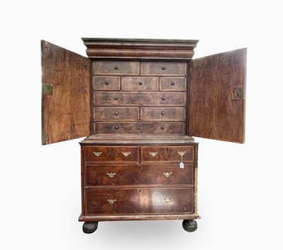 Lot 365 - An early 18th century walnut cabinet on chest,...