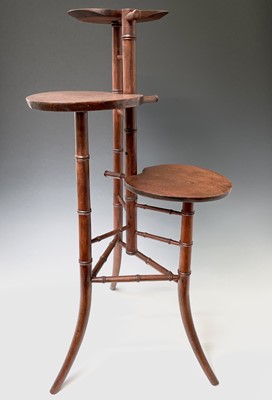 Lot 3088 - An Arts and Crafts mahogany stand, with three...