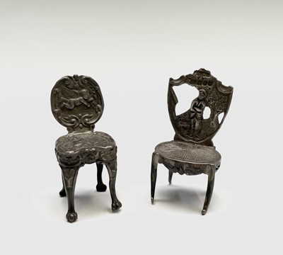 Lot 436 - Two miniature silver chairs, one by Levi &...