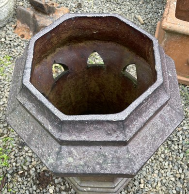Lot 394 - A terracotta octagonal chimney pot with...