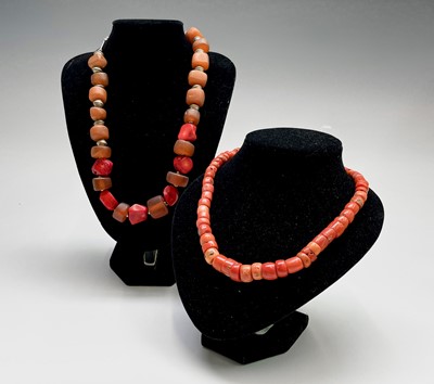 Lot 276 - A coral and resin necklace with silver fitting...