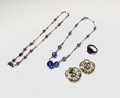 Lot 142 - Two paste necklaces, a clasp and a silver...