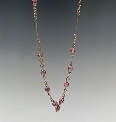 Lot 142 - Two paste necklaces, a clasp and a silver...