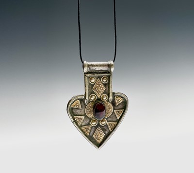 Lot 1067 - An Arabic white metal pendant,circa 1900, 8 x...