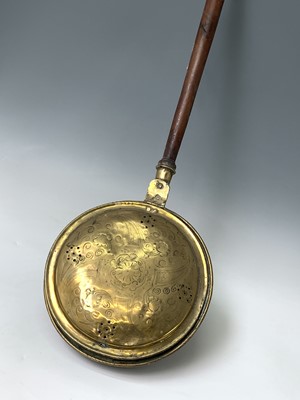 Lot 438 - An 18th century brass warming pan, with turned...