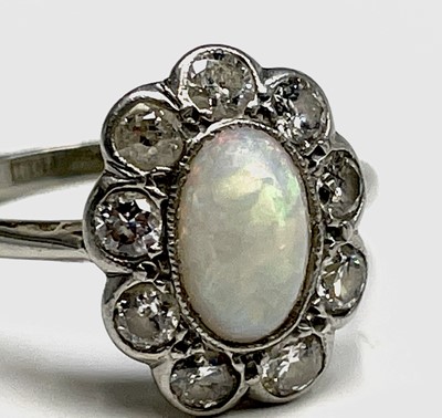 Lot 104 - An 18ct white gold and platinum, opal and...