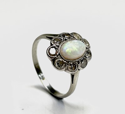 Lot 104 - An 18ct white gold and platinum, opal and...