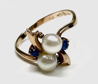 Lot 57 - A 10ct gold dress ring set with two pearls and...