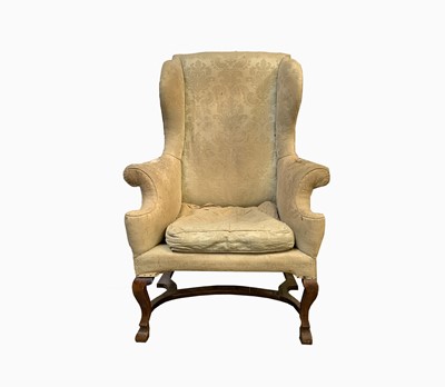 Lot 451 - A Georgian walnut upholstered wing armchair,...