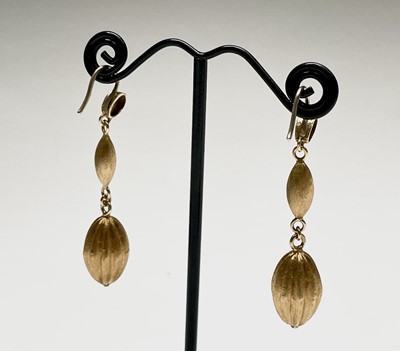 Lot 150 - A pair of contemporary 18ct gold matt earrings...