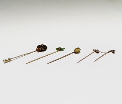 Lot 226 - A gold nugget stick pin with 18ct gold pin...