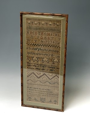 Lot 466 - An early 19th century woolwork sampler, by...