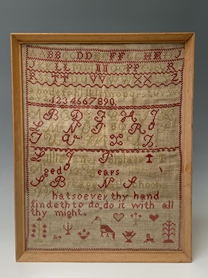 Lot 467 - A 19th century woolwork alphabet sampler, by...