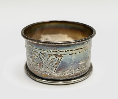 Lot 427 - Four unmatched engraved silver napkin rings,...