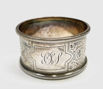 Lot 427 - Four unmatched engraved silver napkin rings,...