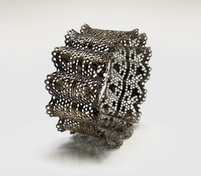 Lot 427 - Four unmatched engraved silver napkin rings,...