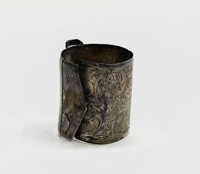 Lot 427 - Four unmatched engraved silver napkin rings,...
