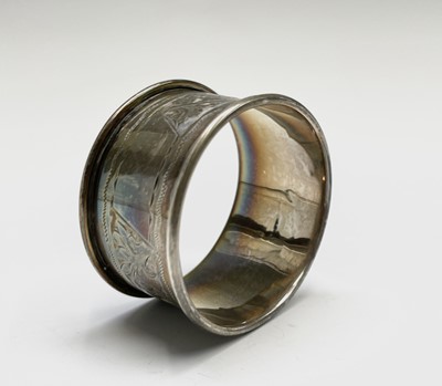 Lot 427 - Four unmatched engraved silver napkin rings,...