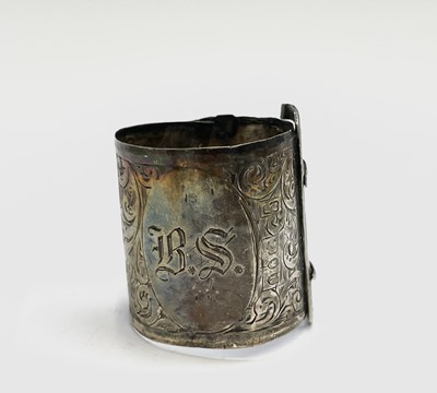 Lot 427 - Four unmatched engraved silver napkin rings,...