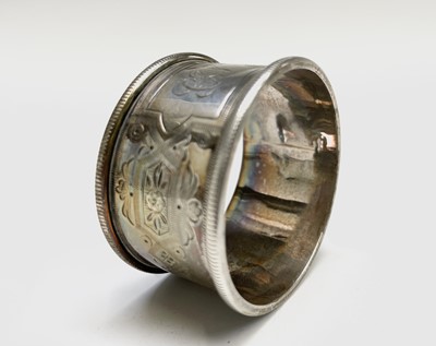 Lot 427 - Four unmatched engraved silver napkin rings,...