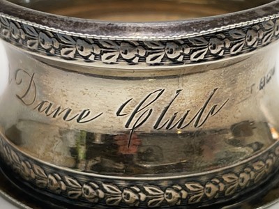 Lot 427 - Four unmatched engraved silver napkin rings,...