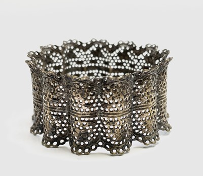 Lot 427 - Four unmatched engraved silver napkin rings,...