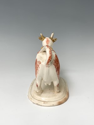 Lot 473 - A 19th century Staffordshire cow creamer,...