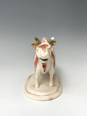 Lot 473 - A 19th century Staffordshire cow creamer,...