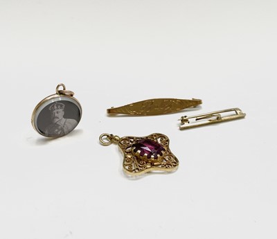 Lot 234 - A high purity gold pendant set a pink stone,...