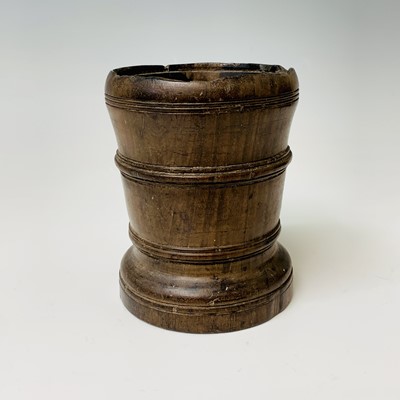 Lot 491 - An 18th century treen mortar, with ring turned...