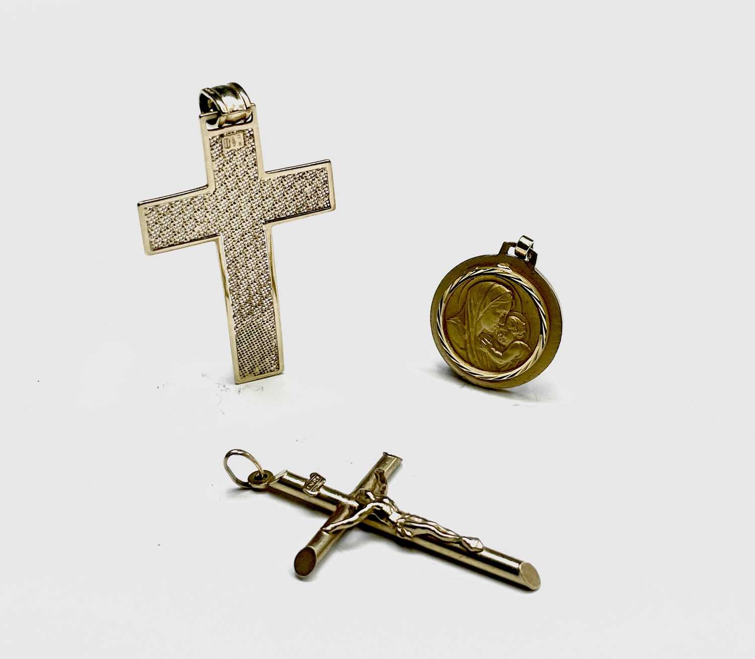Lot 12 - A 9ct gold cross a 9ct gold crucifix and a...